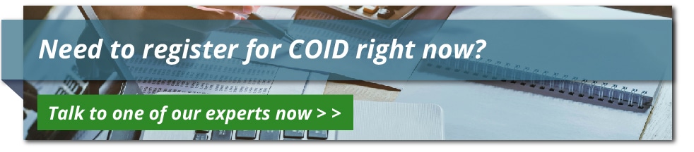 An individual completing compensation fund registration forms on a digital platform for efficient Coid registration online
